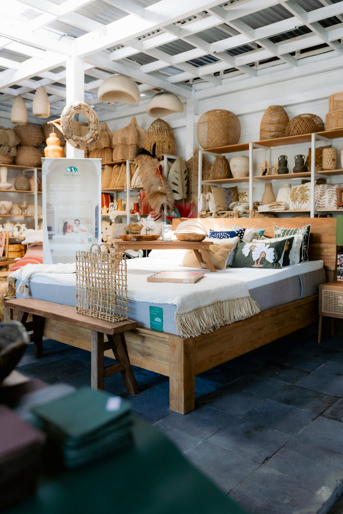 Mattress and bedding display inside a Bali furniture showroom