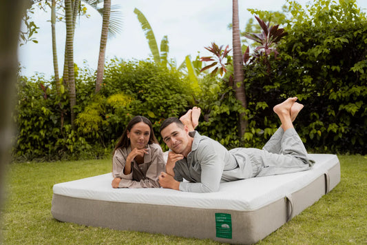 A bed in a warm, humid Bali bedroom